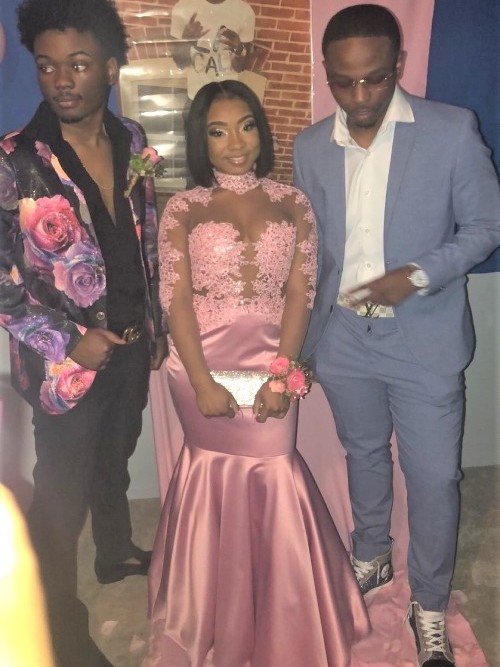 Pink Gown with Suited Men